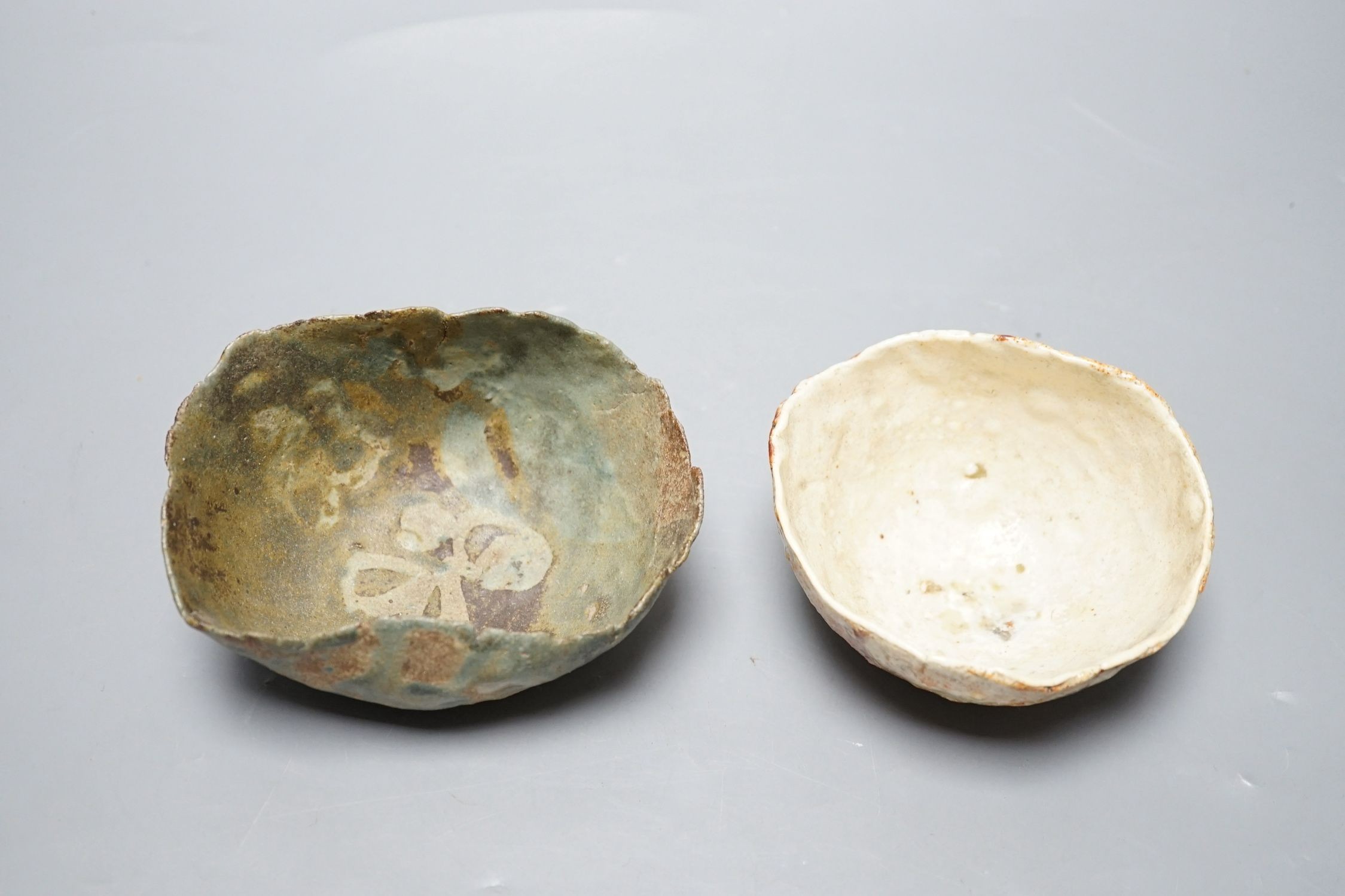 Ewen Henderson (1934-2000), two hand-built mixed laminated clay dishes, largest 12.5cm wide